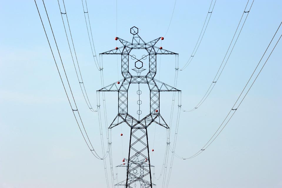 Electric pylons resemble clowns near a motorway in Hungary